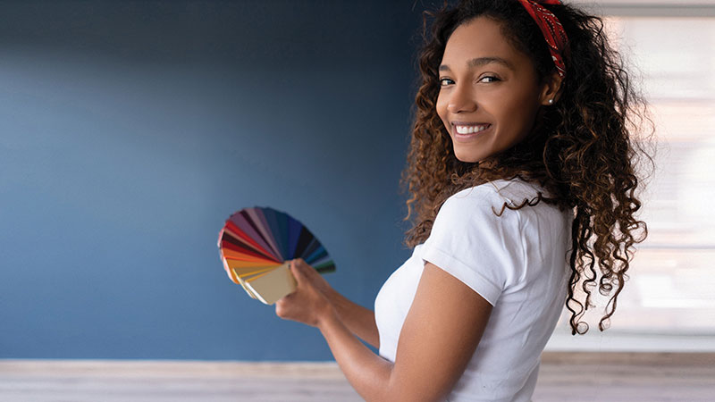 Woman holding paint swatches