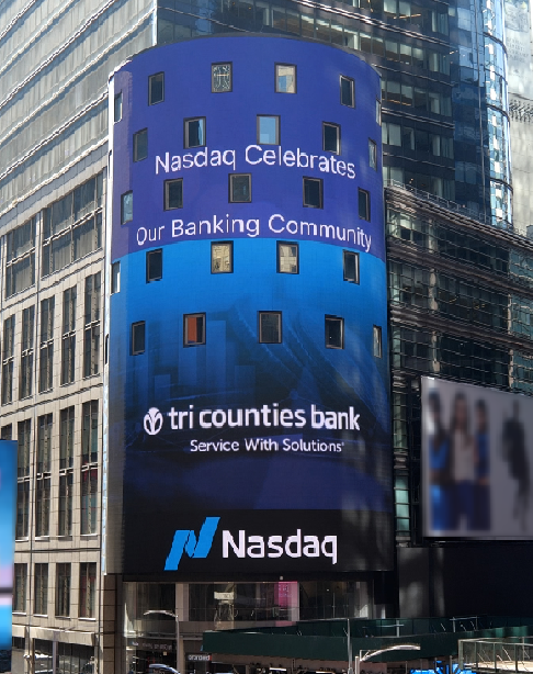 A sign showing Nasdaq Celebrates the Banking Community with Tri Counties Bank