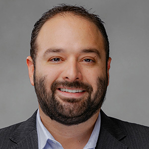Headshot of Aytom Salomon, smiling professionally.