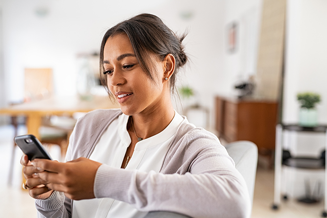 A young woman looking at her mobile phone