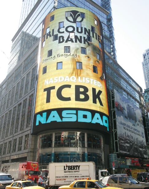 A sign showing Tri Counties Bank (TCBK) listed on Nasdaq