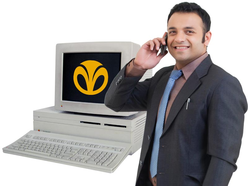 A desktop computer and a banking employee using the phone