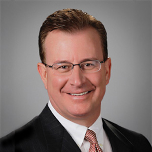 Headshot of Patrick Luis, smiling professionally.