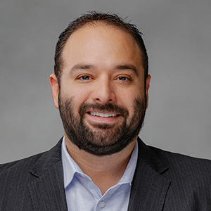 Headshot of Aytom Salomon, smiling professionally.