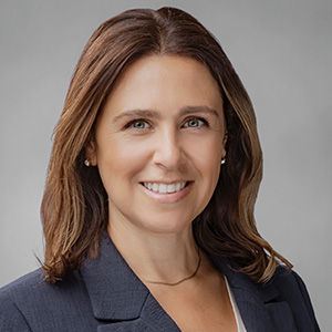 Headshot of Raquel Leal, smiling professionally.