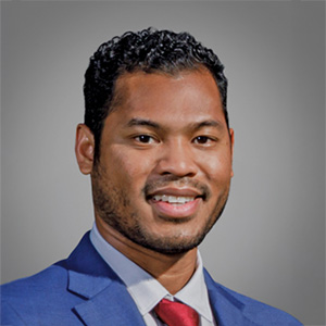 Headshot of Leo Arrington, smiling professionally.