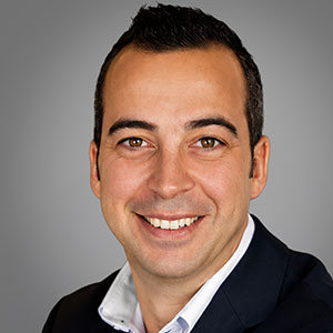 Headshot of Pedro Ferrer, smiling professionally.