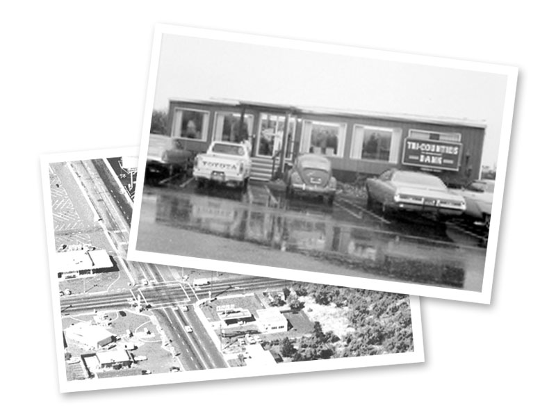 Black and white photographs of the first branch was a mobile facility with cars outside, taken in 1975